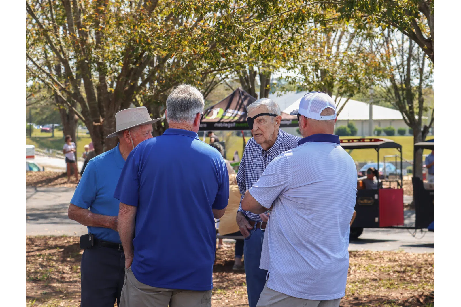 a group of men standing outside