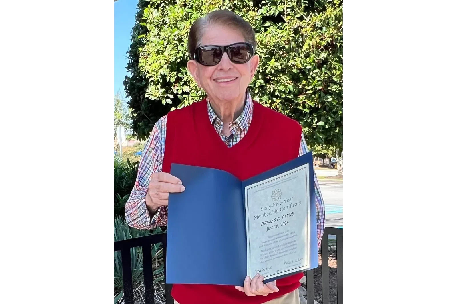 a person holding a certificate