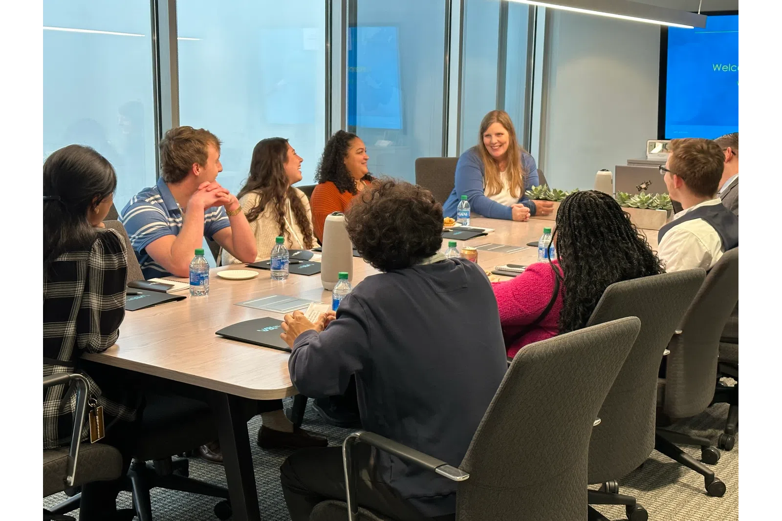 a group of people sitting around a table