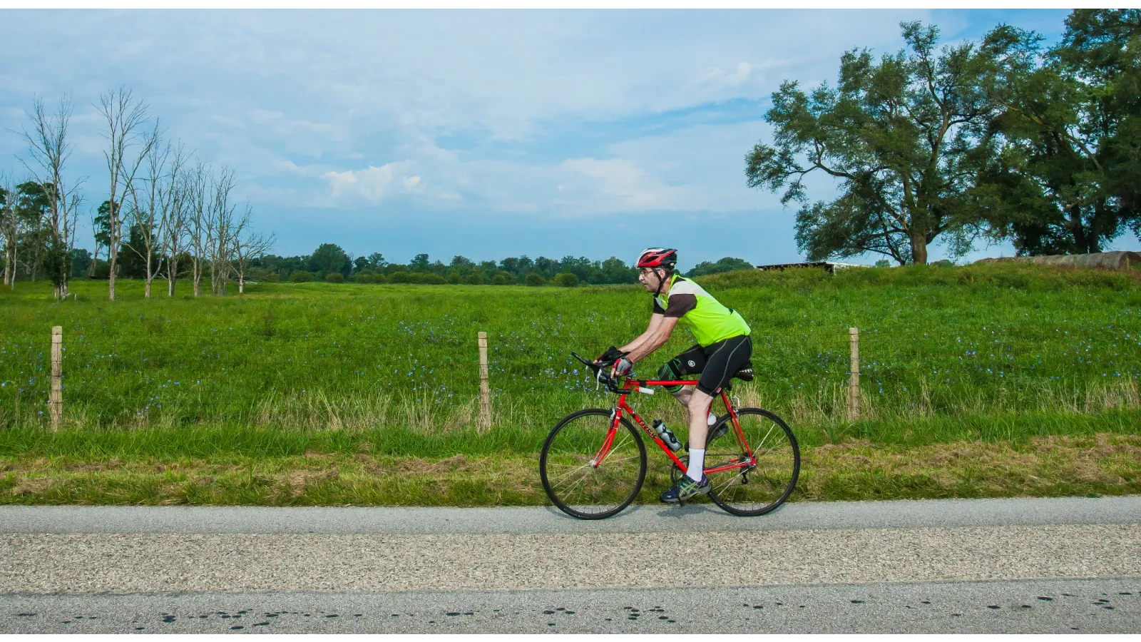 a man riding a bicycle on a road during Reid Ride