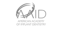 Logo of the American Academy of Implant Dentistry featuring stylized text and circular design