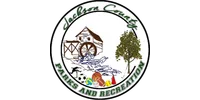 Logo of Jackson County Parks and Recreation featuring a watermill, tree, sports equipment, and golf club.
