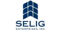 Selig Enterprises Inc. logo with blue stylized geometric shapes above bold text on a transparent background.
