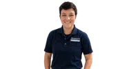 Smiling person wearing navy polo shirt with Property Masters logo on pocket against transparent background