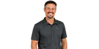 Smiling man with short hair and goatee wearing a dark gray polo shirt with a subtle logo on the chest.
