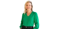 Portrait of a smiling woman with blonde hair wearing a green blouse, black belt, and silver jewelry.