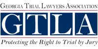 Logo of Georgia Trial Lawyers Association with GTLA acronym and tagline protecting trial rights.