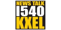 Bold yellow and white text logo for News Talk 1540 KXEL radio station on black background