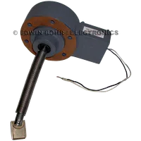 Gray rotary electric motor component with round mounting plate and attached spring-loaded shaft with wires.