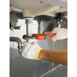 a refrigerator freezer sitting next to a sink