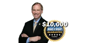 Smiling man in a suit with a $10,000 guarantee badge promoting TrustDALE's services.
