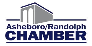 Logo of Asheboro Randolph Chamber with a stylized building illustration and bold blue text