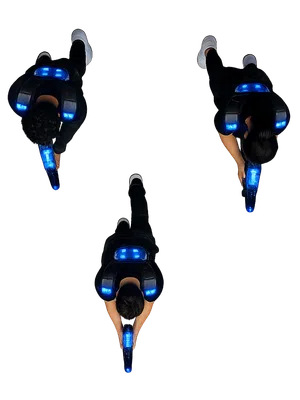 Overhead view of three people aiming laser tag guns wearing illuminated vests with blue lights on black background