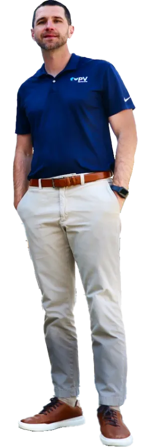 a man wearing a blue shirt and white pants