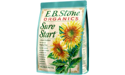 E.B. Stone Organics Sure Start starter fertilizer bag with sunflower illustrations and plant care text.