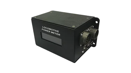 Black locomotive power meter device with digital display and circular connector on transparent background