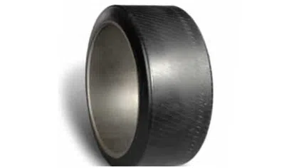 Close-up of a wide black hockey tape roll with textured surface and open cardboard core on white background