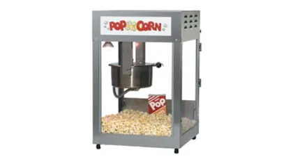 Classic commercial popcorn machine filled with freshly popped popcorn and a red striped popcorn box inside.