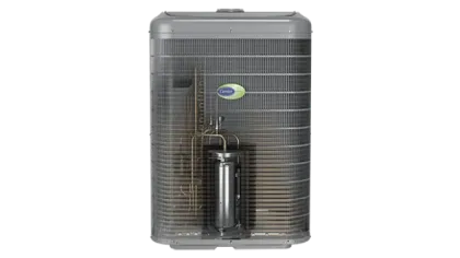 Detailed view of a Carrier air conditioning unit showing internal compressor and coil components inside metal grille.