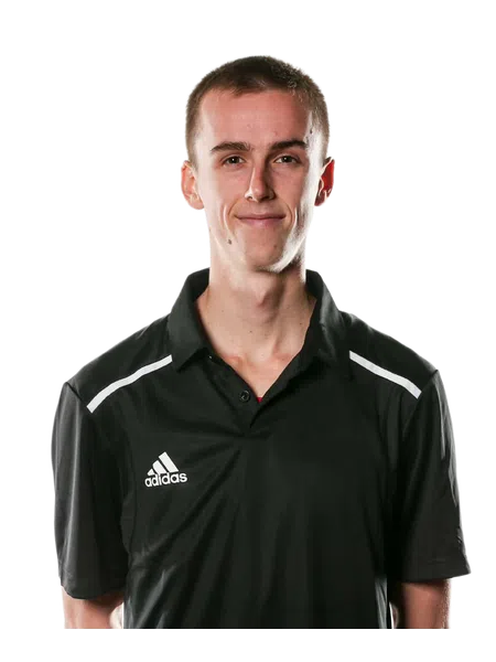 Young man wearing a black Adidas polo shirt smiling standing against a transparent background