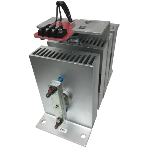 Silver industrial electrical component with heat sink fins and red terminal connectors for DC power.