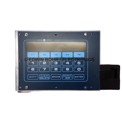 General Electric numeric keypad with function keys and LCD display panel in dark casing