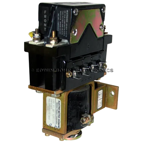 Black and gold General Motors Electro-Motive relay with front label and metal mounting bracket.