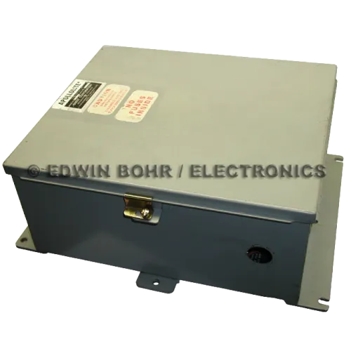 Gray metal electrical enclosure box with warning labels and latch on top, used for housing electronic components.