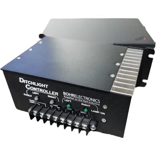 Black Ditchlight Controller by Bohrelectronics with labeled ports and indicator lights for rail industry use.