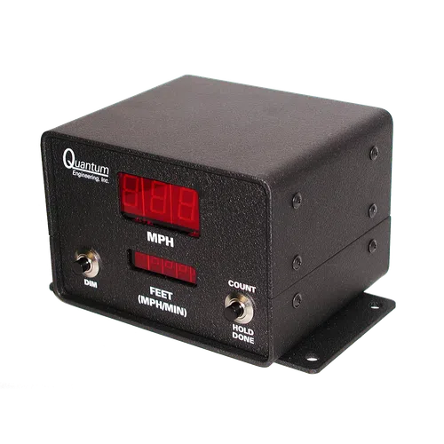 Black Quantum Engineering speed measurement device with digital red LED displays and toggle switches on a metal base.