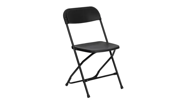 Black folding chair with metal frame and plastic seat and backrest, isolated on white background.