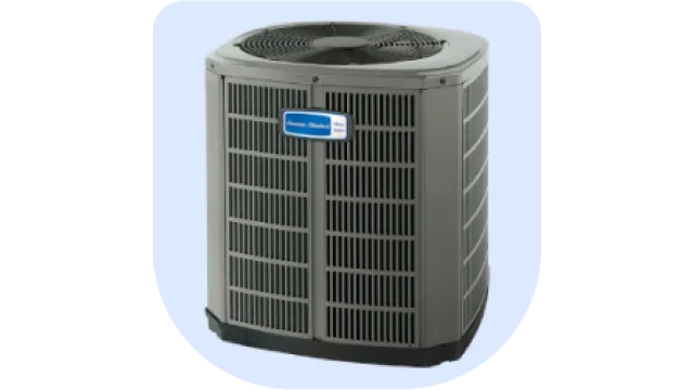 American Standard outdoor air conditioning unit with protective grille and fan.