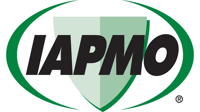 IAPMO logo with bold black letters and a green shield surrounded by a green oval ring