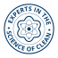Blue circular emblem with atom symbol and text Experts in the Science of Clean on dark background