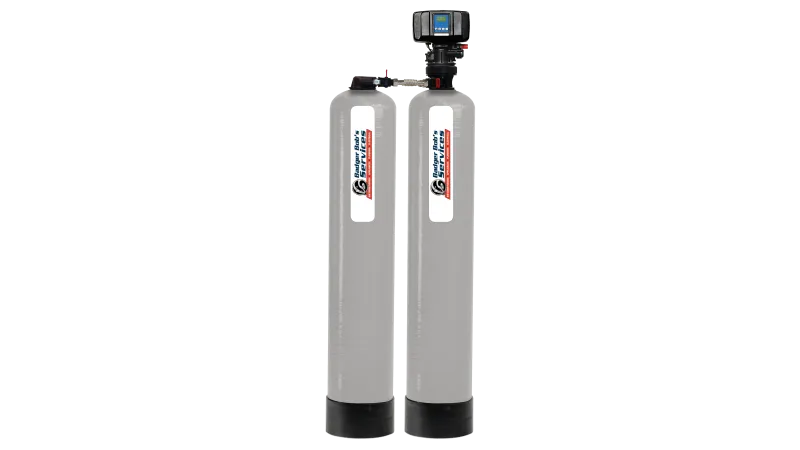 Water filtration system with two tall cylindrical tanks and control valve on top of one tank