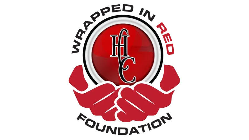 Red hands holding a red circle with HHC initials, surrounded by the words Wrapped in Red Foundation.