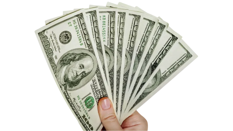 Hand holding a fan of seven US one hundred dollar bills spread out on a white background