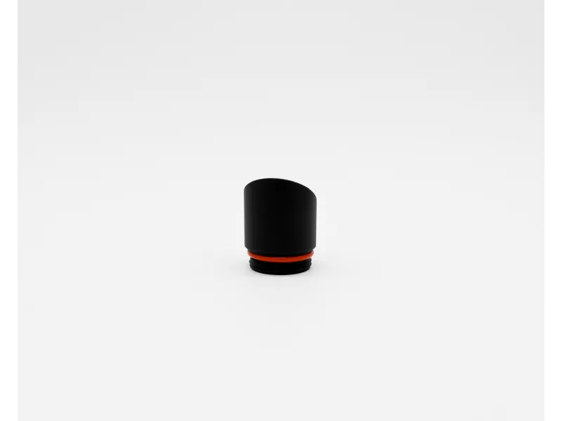 Small black cylindrical cap with a red sealing ring on a white background.