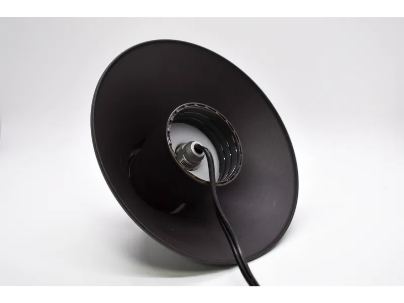 a black speaker with a wire