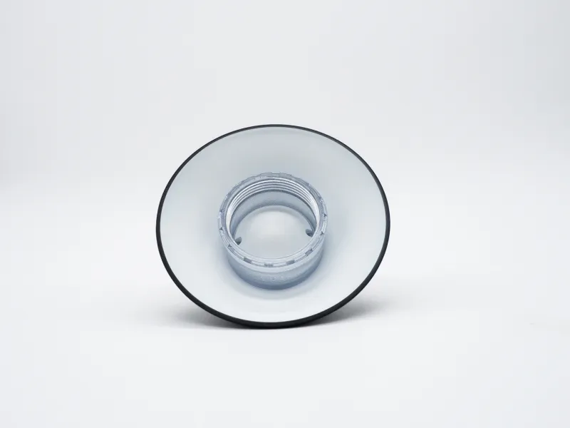 White and black speaker cone viewed from the front against a white background.