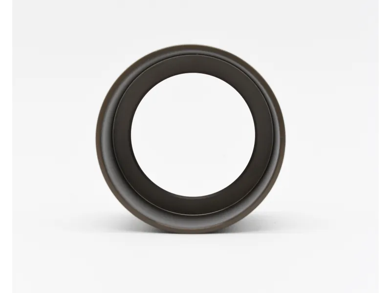 Close-up of a black circular ring with smooth edges on a white background.
