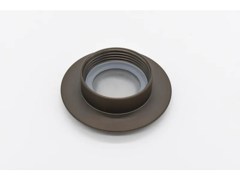 Close-up of a dark metal threaded ring with a flat base and inner rubber gasket on a white background