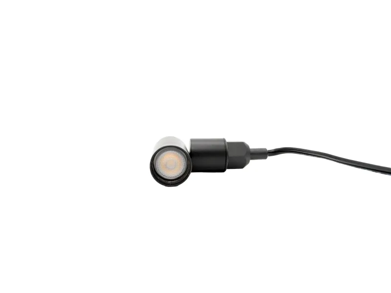 Black wired earbud with silicone tip isolated on white background showing speaker mesh.