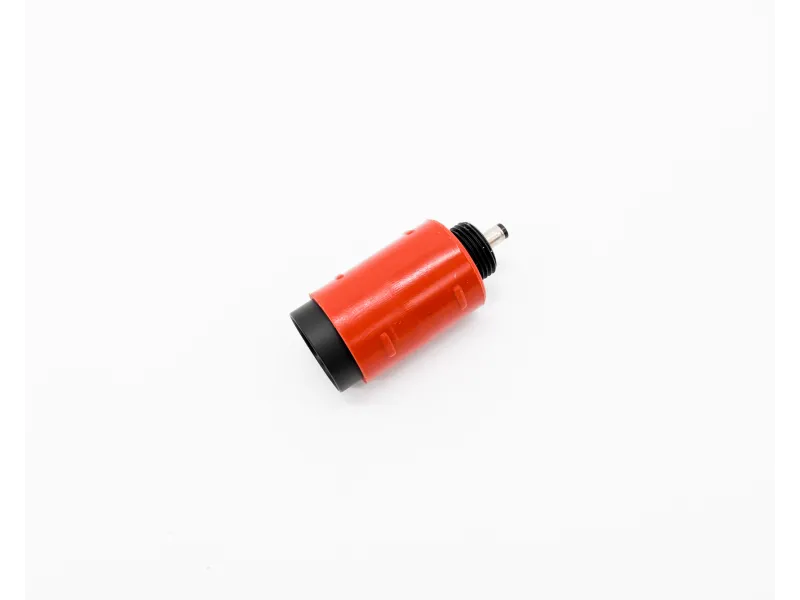 Close-up of a red and black cylindrical electronic component on a white background.