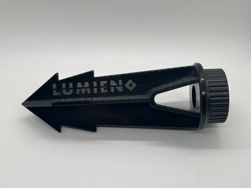 a black stapler with a white label