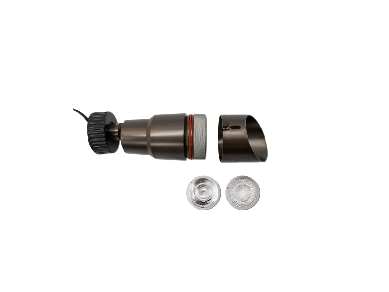 Disassembled black electric coffee grinder with two silver grinding discs on white background