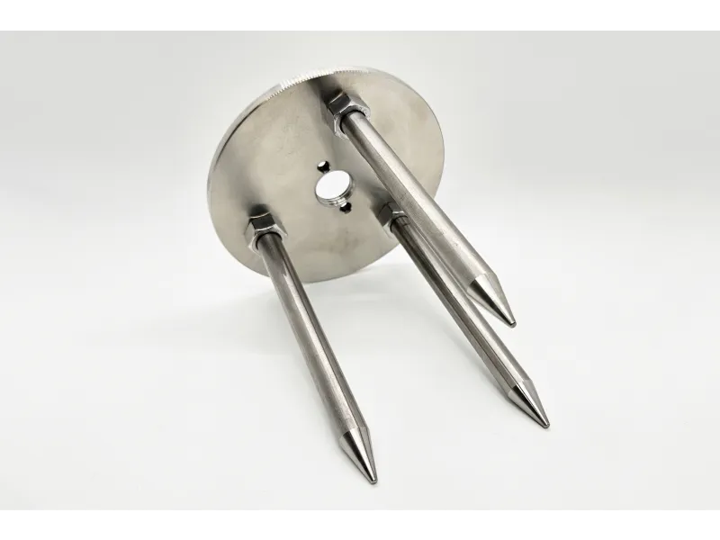 a silver and black metal spoon