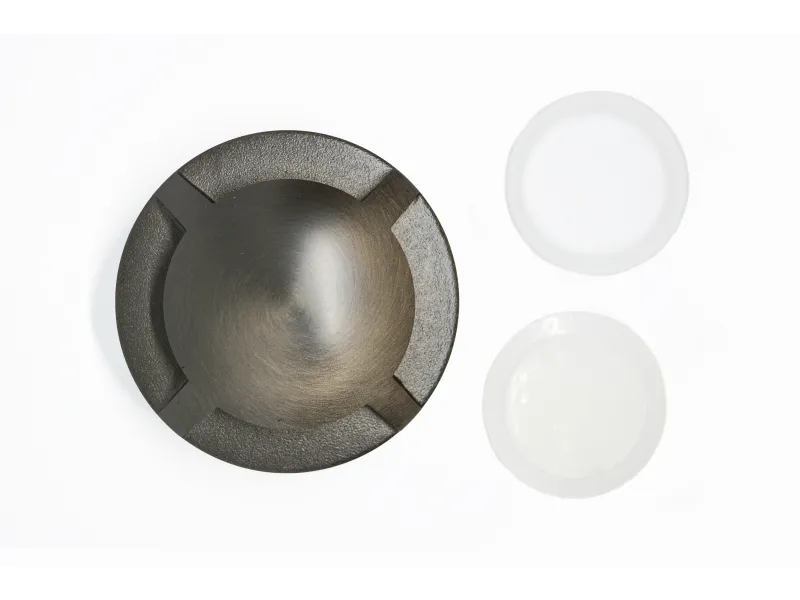 a silver and black metal bowl