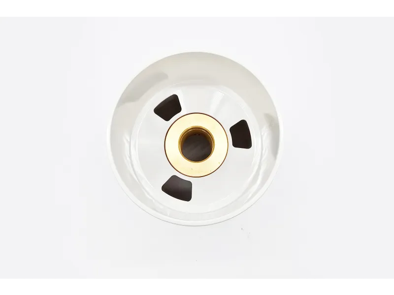 a white circular object with holes in it