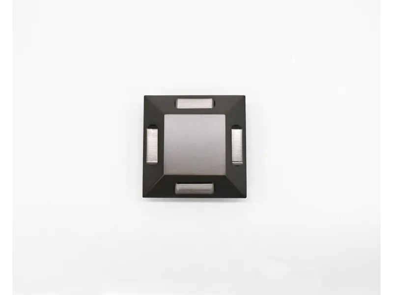 Top view of a square metal heatsink with a central raised area and four surrounding heat pipes on white background
